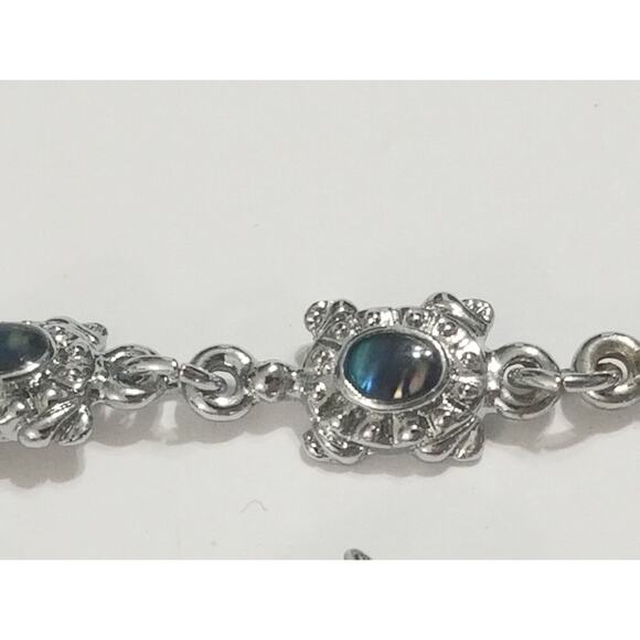 2- 7" silvertone bracelets dolfins and sea turtles this one has a 2" ext. b12* - Picture 16 of 16